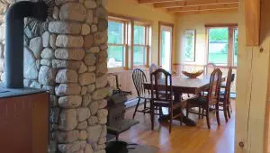 Fireplace stone, wood interior, handmade dining table and chairs