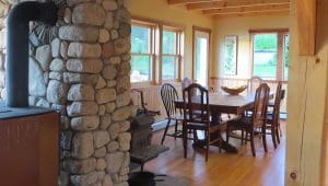 Fireplace stone, wood interior, handmade dining table and chairs